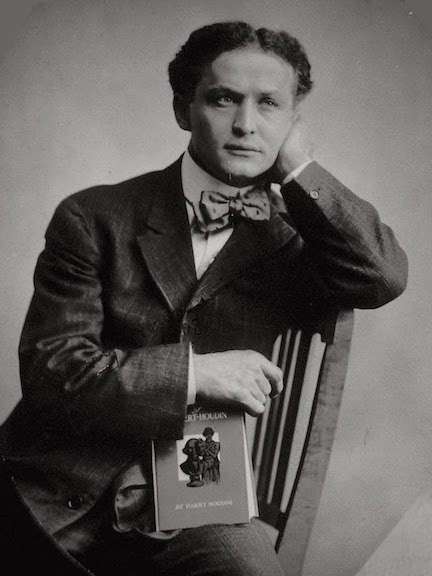 Harry Houdini with book